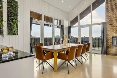 a dining room with a table and chairs at 1314-Thisted-Lyngbakken-14 in Thisted