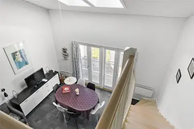 a living room with a table and a dining room at 212-Vestervig-Havnevej-1-lejl-12 in Vestervig