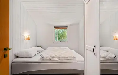a white bed in a room with a window at 3 Bedroom Amazing Home In Aabybro in Åbybro