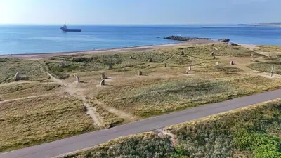 an aerial view of a road next to the ocean at Ny lækker lejlighed på Havnen in Thyborøn