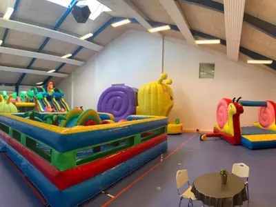 a play room with several different types of play equipment at 4 star holiday home in Thyborøn in Thyborøn