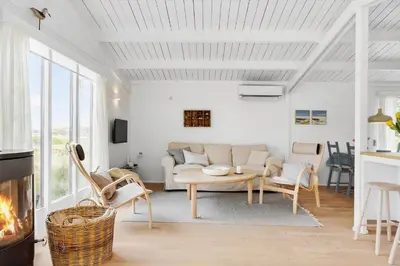 a living room with a couch and a table at 399-Thisted-Sotungevej-21 in Nørre Vorupør