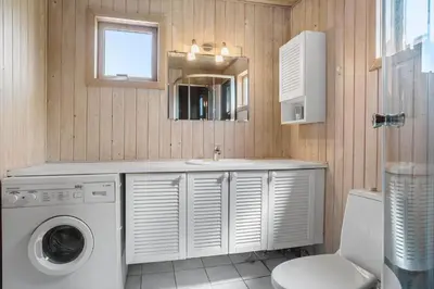a bathroom with a washing machine and a sink at 421-Thisted-Fiskervej-147 in Nørre Vorupør