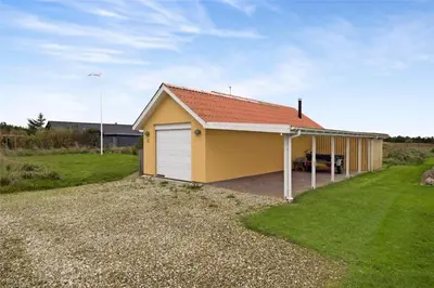 a small yellow garage with a red roof at 644-Thisted-Kristinesvej-4 in Thisted