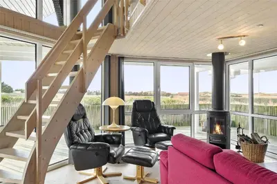 a living room with a couch and a fire place at 644-Thisted-Kristinesvej-4 in Thisted