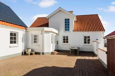 a white house with a patio in front of it at 823-Thisted-Knottivej-3 in Thisted