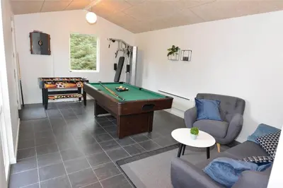 a living room with a ping pong table and a pool table at 454-Thisted-Havbovej-36 in Thisted