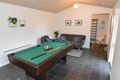 a living room with a pool table and a couch at 454-Thisted-Havbovej-36 in Thisted