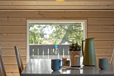 a table in a room with a window and a table with chairs at 528-Thisted-Tunvej-28 in Thisted