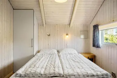 a bed in a small room with a window at 528-Thisted-Tunvej-28 in Thisted