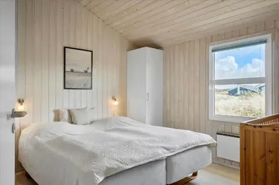 a bedroom with a white bed and a window at 1026-Thisted-Niels-Vognmands-Vej-26 in Torsted