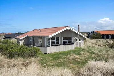 a house with a red roof on a beach at 1026-Thisted-Niels-Vognmands-Vej-26 in Torsted