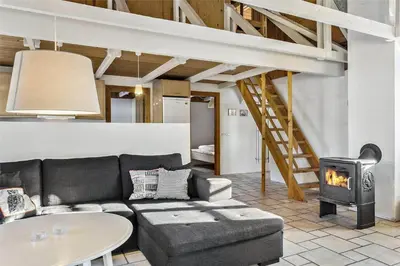 a living room with a couch and a stove at 707-Thisted-Lyngvej-12 in Thisted