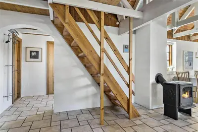 a staircase in a room with a stove at 707-Thisted-Lyngvej-12 in Thisted