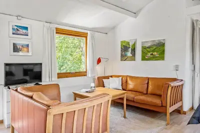 a living room with a couch and a table at 168-Thisted-Sandtornvej-8 in Thisted