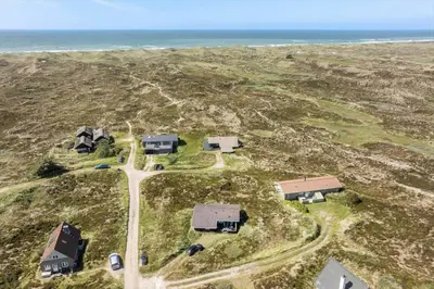 an aerial view of a group of houses and the ocean at 334-Snedsted-Somaerkevej-64-B in Snedsted