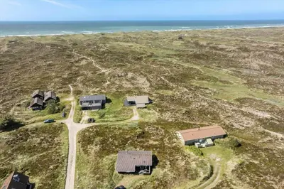 an aerial view of a group of houses and the ocean at 334-Snedsted-Somaerkevej-64-B in Snedsted