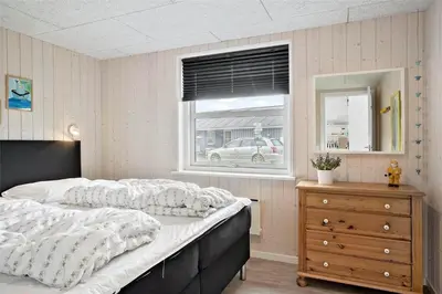 a bedroom with a large bed and a window at 897-Thisted-Nordsovej-46-C in Thisted