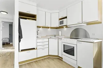 a white kitchen with white cabinets and appliances at 736-Thisted-Kuttervej-6 in Thisted