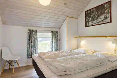 a bedroom with a large bed and a window at 150-Thisted-Orredvej-32 in Thisted