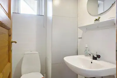 a white bathroom with a toilet and a sink at 150-Thisted-Orredvej-32 in Thisted