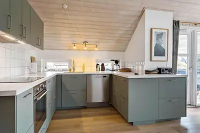 a kitchen with green cabinets and a wooden ceiling at 150-Thisted-Orredvej-32 in Thisted