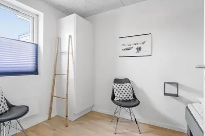 a room with two chairs and a ladder at 792-Thisted-Havstokken-22-1 in Thisted