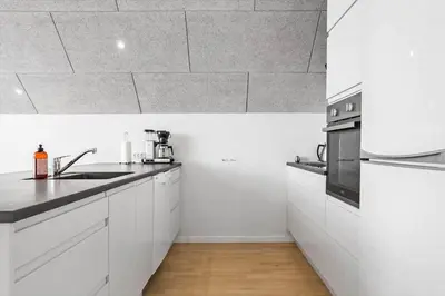 a white kitchen with a sink and a stove at 792-Thisted-Havstokken-22-1 in Thisted