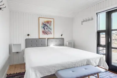 a white bedroom with a large bed and a window at 310-Thisted-Store-Knuds-Vej-7 in Thisted