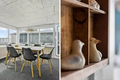 a dining room with a table and a vase on a shelf at 518-Thisted-Klemsvej-18 in Thisted