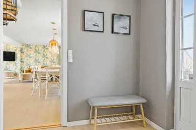 a living room with a chair and a table at 193-Vestervig-Vesterhavsvej-36 in Vestervig
