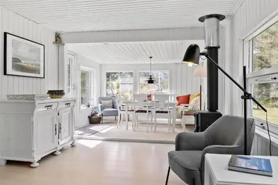 a living room with a table and a chair at 630-Thisted-Kristinesvej-40 in Thisted