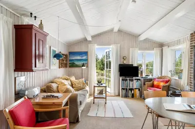 a living room with a couch and a table at 255-Thisted-Kraen-Knudsens-Vej-13 in Thisted