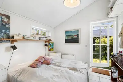 a white bedroom with a bed and a window at 255-Thisted-Kraen-Knudsens-Vej-13 in Thisted