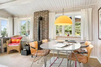 a dining room with a table and chairs at 255-Thisted-Kraen-Knudsens-Vej-13 in Thisted