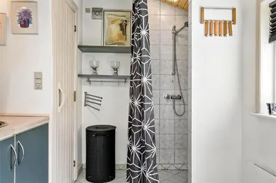 a bathroom with a shower with a glass door at 704-Thisted-Kristinesvej-54 in Thisted