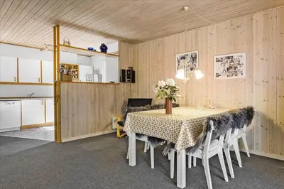 a kitchen and dining room with a table and chairs at 406-Vestervig-Bekkasinvej-6 in Vestervig