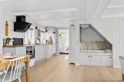 a kitchen with a couch in the corner of a room at 492-Thisted-Tunvej-7-B in Thisted