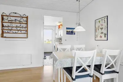 a kitchen and dining room with a table and chairs at 138-Thisted-Lervej-8-B in Thisted