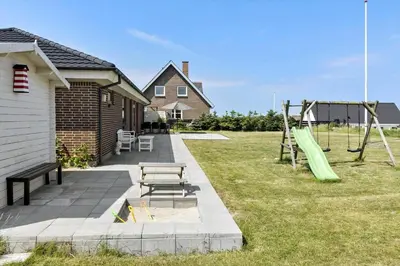 a backyard with a playground with a slide and a swing at 138-Thisted-Lervej-8-B in Thisted