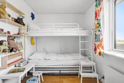 a bedroom with a white bunk bed and a window at 138-Thisted-Lervej-8-B in Thisted