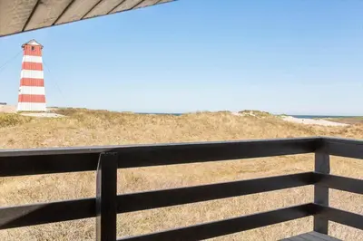 a lighthouse sitting on top of a hill with a fence at 652-Thisted-Orredvej-58 in Thisted