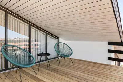 two chairs and a table on a balcony at 652-Thisted-Orredvej-58 in Thisted
