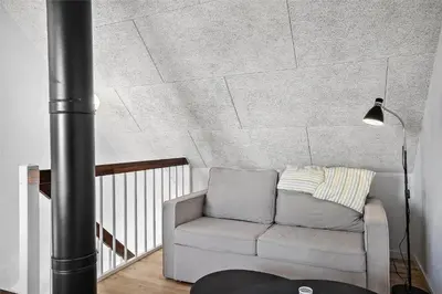 a living room with a couch and a lamp at 803-Thisted-Hummervej-3 in Thisted