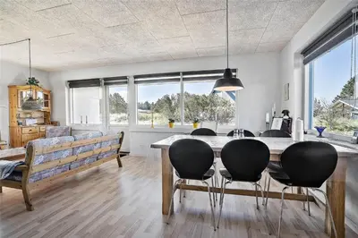 a dining room with a table and some chairs at 803-Thisted-Hummervej-3 in Thisted