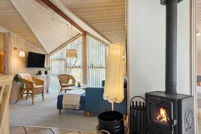 a room with a stove in a room with a bedroom at 257-Thisted-Blamunkevej-34 in Thisted