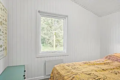 a bedroom with a bed and a window at 160-Thisted-Bredkaervej-33 in Thisted