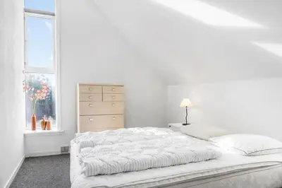 a white bedroom with a bed and a window at 541-Thisted-Nordsovej-49 in Thisted
