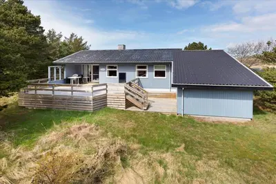 a small house with a porch and a deck at 337-Thisted-Hummervej-11 in Thisted