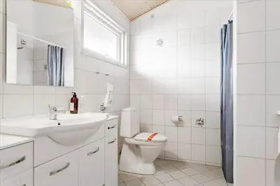 a white bathroom with a toilet and a sink at 337-Thisted-Hummervej-11 in Thisted
